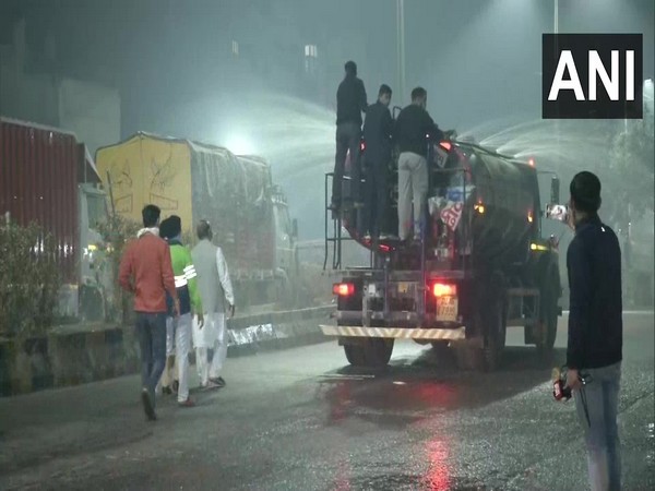 North MCD sprinking water to control air pollution. Photo/ANI