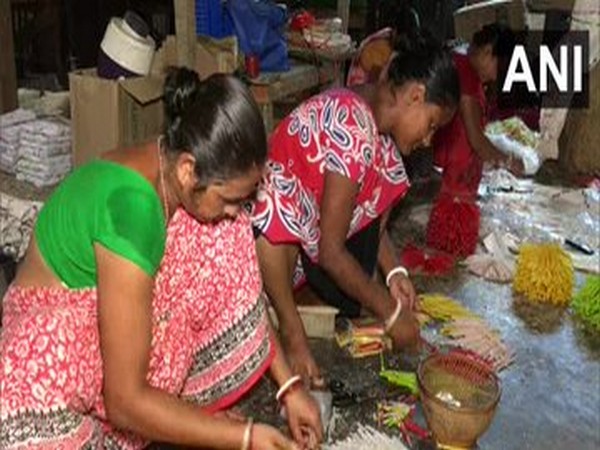 A group of women making candles in Agartala (Photo/ANI)