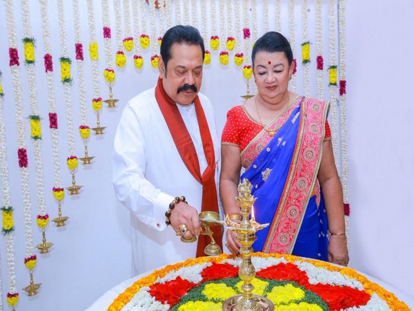 Sri Lankan Prime Minister Mahinda Rajapaksa along with his wife lighting lamp on the occasion of Diwali (Image: Rajapaksa/ Twitter)