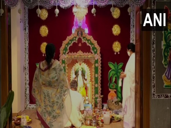 Mamata Banerjee participating in Kali Puja at her residence. (Photo/ANI)