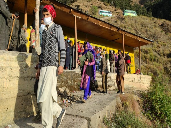 Many line up outsids th Sungri polling station in Chassana area of the Reasi district. (Photo/ANI)