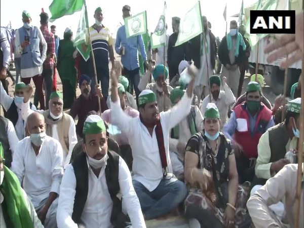 Farmers protest in Burari on Saturday. (Photo/ANI)