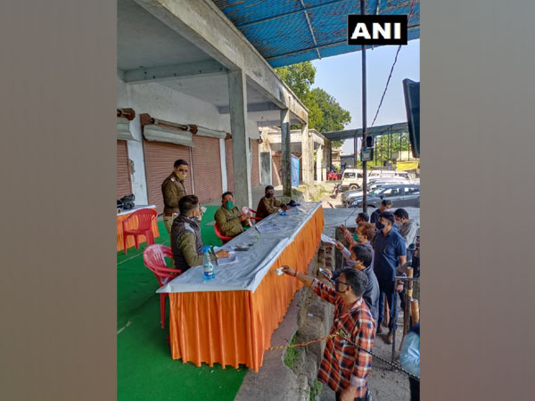 COVID-19 testing being conducted at Aasarodhi Inter-State Check Post. (Photo/ANI)