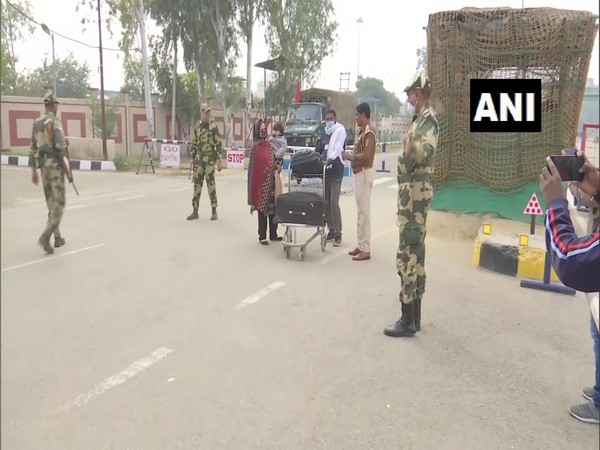 Stranded people in Pakistan return to India through Attari border. (Photo/ANI)