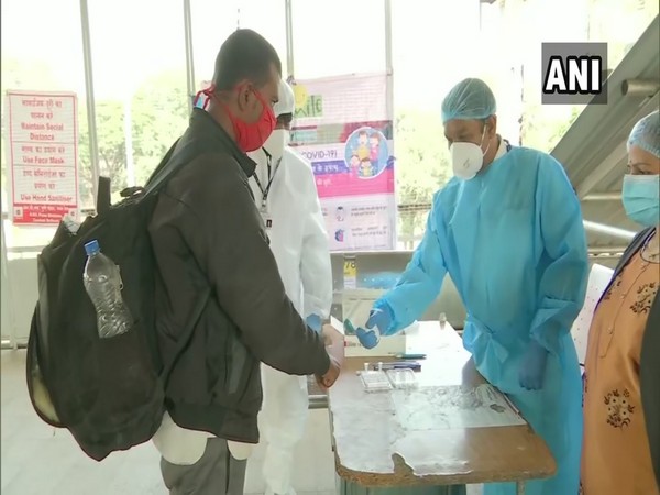 Patients undergoing COVID-19 temperature checks at the Pune Railway Station. (Photo/ANI)