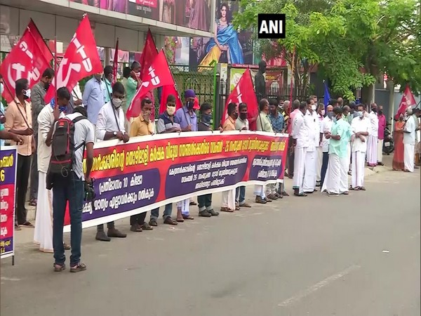Centre of Indian Trade Unions (CITU) workers formed a human chain in Kochi as part of the protest against the Centre's labour laws. (Photo/ANI)