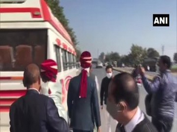A groom, along with his wedding party was seen walking on the road due to road blockade amidst ongoing farmers' protest (Photo/ANI) 
