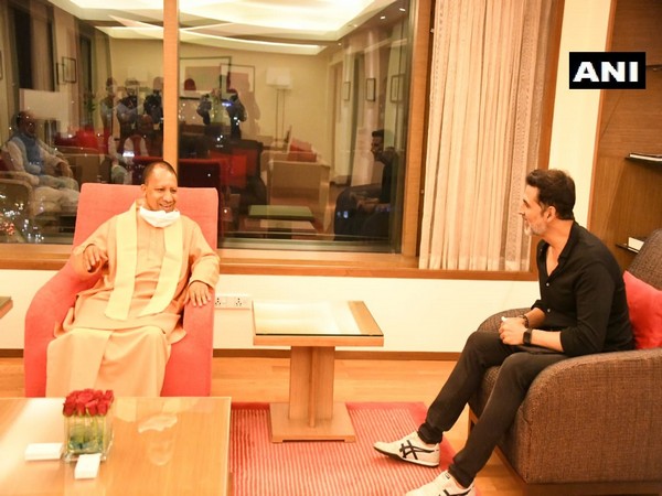 Bollywood actor Akshay Kumar in conversation with UP CM Yogi Adityanath in Mumbai on Tuesday night.