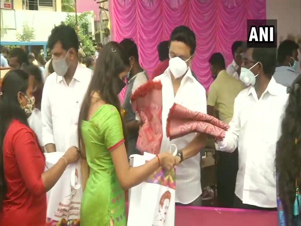 DMK president distributing relief material at Ambedkar nagar on Monday (Photo/ANI)