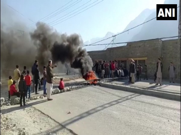 Locals set fire to an electricity transmission tower in protest, in the Gilgit-Baltistan region. (Photo/ANI)