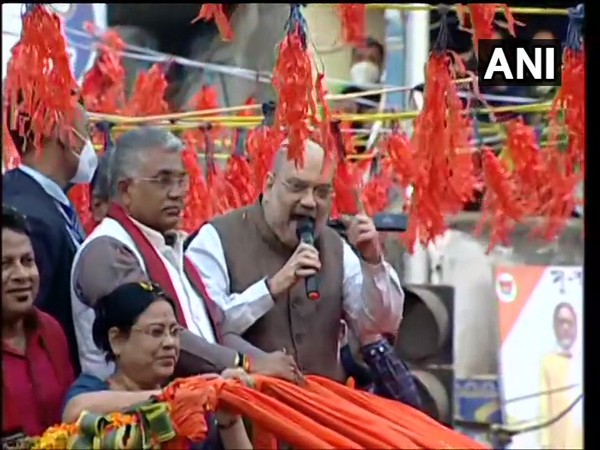 Union Home Minister Amit Shah (speaking) accompanied by WB BJP chief Dilip Ghosh (to his right) at a roadshow in Birbhum district on Sunday [Photo/ANI]