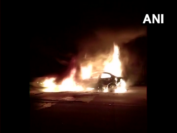 A car caught fire on the Agra-Lucknow expressway. (Photo/ANI)