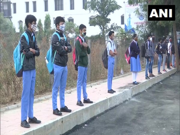 Students maintain social distancing at a school in Ahmedabad. (Photo/ANI)