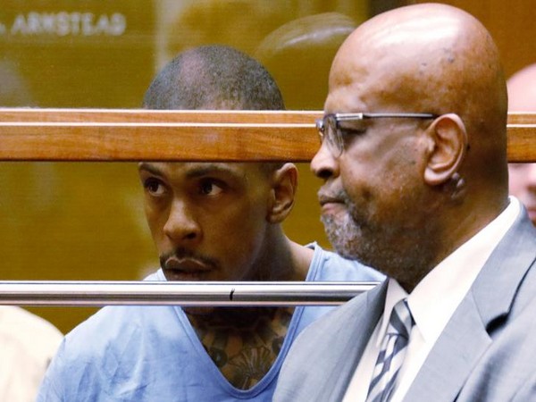 Eric Holder, suspected of fatally shooting rapper Nipsey Hussle, appears with his attorney Chris Darden for an arraignment hearing at the Los Angeles County courthouse in Los Angeles, REUTERS