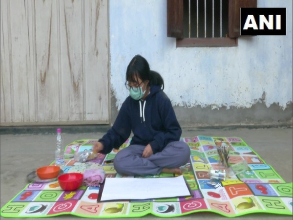 Venish Keisham, a Class 11 Humanities student of Kendriya Vidyalaya painting. (Photo/ANI)