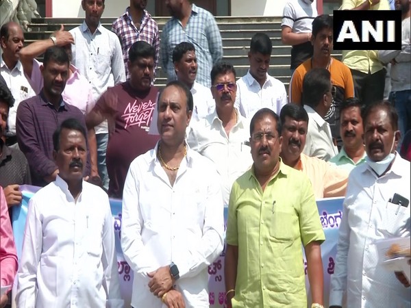 Liquor merchant union members at protest against online sale of liquor
