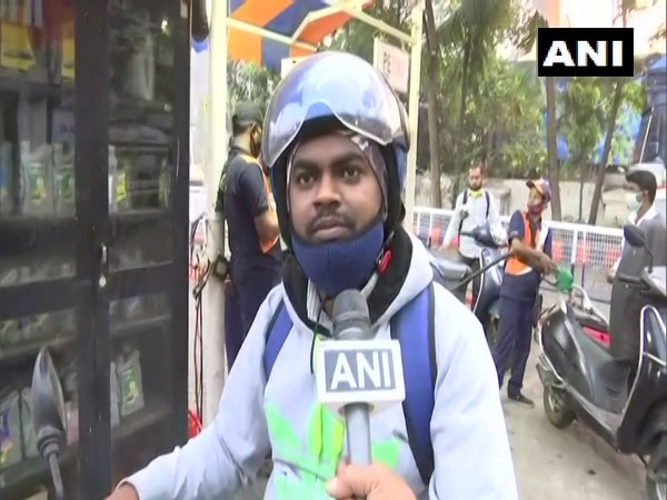 Aman Nishkar, a local reacting on fuel price hike at a petrol station in Mumbai