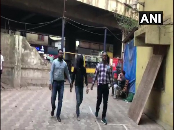 Police taking accused into custody. (Photo/ANI)