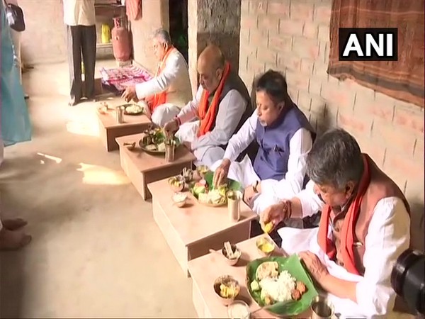 Union Home Minister Amit Shah and senior BJP leaders having lunch in Narayanpur village (Photo/ANI)