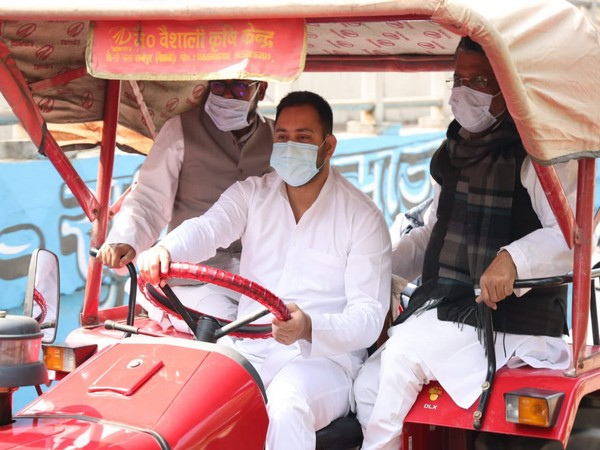 RJD leader Tejashwi Yadav driving tractor in Patna 