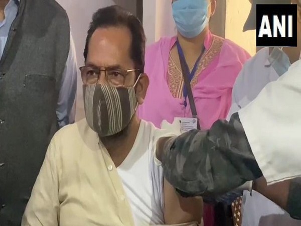 Union Minister Mukhtar Abbas Naqvi receiving first dose of COVID-19 vaccine (Photo/ANI)
