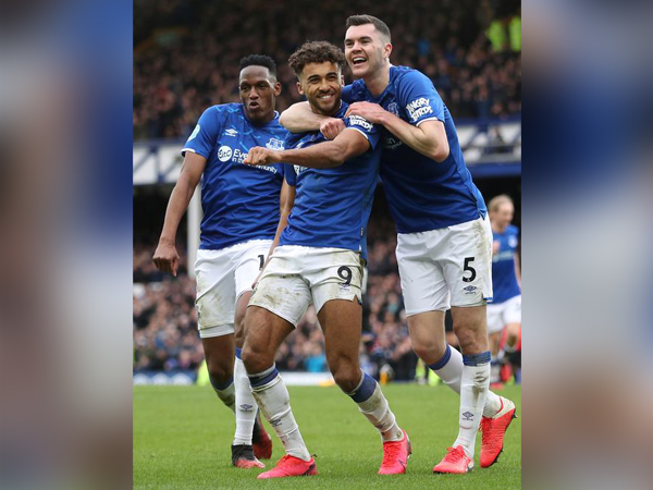 Dominic Calvert-Lewin celebrates scoring their third goal with Michael Keane and Yerry Mina 