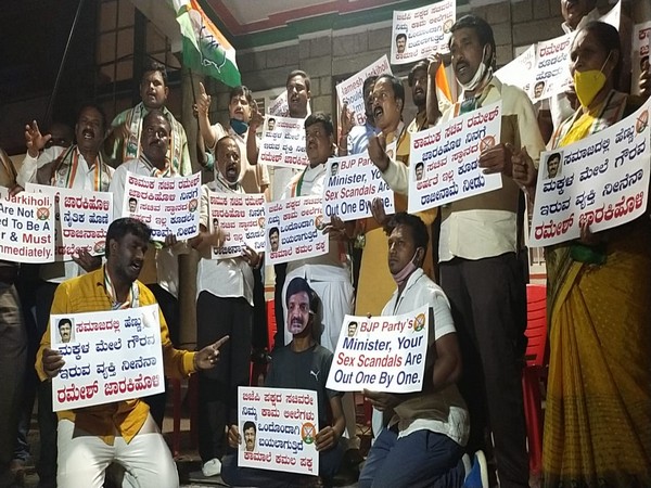 Congress workers protesting against Karnataka cabinet minister Ramesh Jarkiholi. (Photo/ANI)