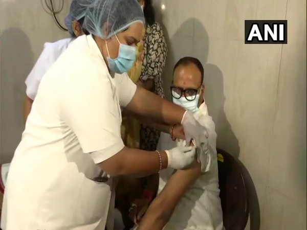 UP Minister Brajesh Pathak receiving first dose of COVID-19 vaccine. (Photo/ANI)