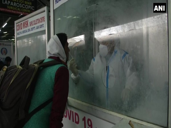 A passenger being tested for COVID-19 at Jammu Railway Station. (Photo/ANI)