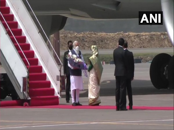 Prime Minister Narendra Modi greets his counterpart Sheikh Hasina in Dhaka on Friday.