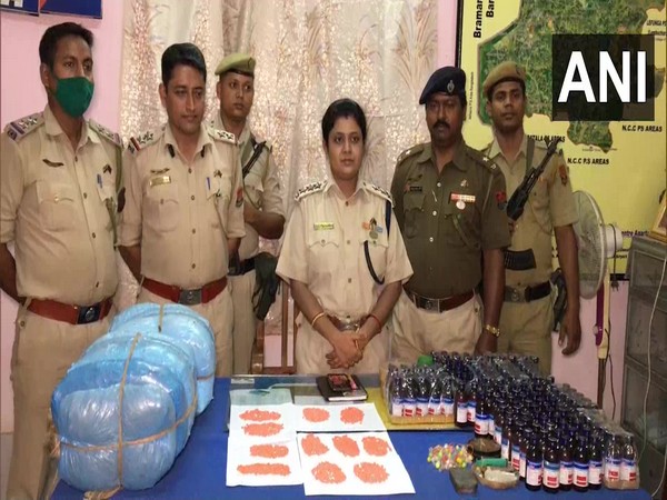 Sub-Divisional Police Officer Priya Madhuri Majumder (centre) and tehe seized drugs. (Photo/ANI)