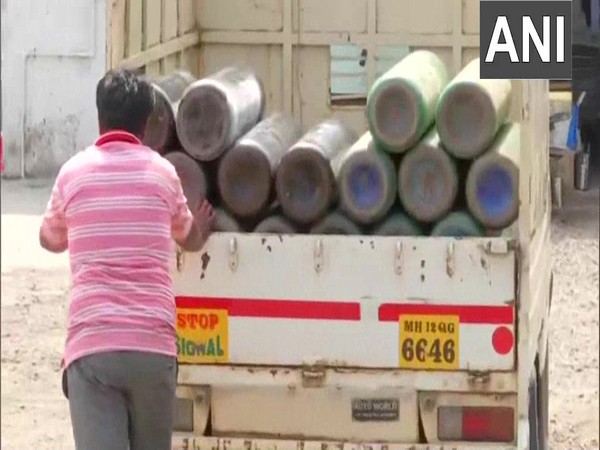 Oxygen cylinders being loaded for supply to hospitals in Pune.