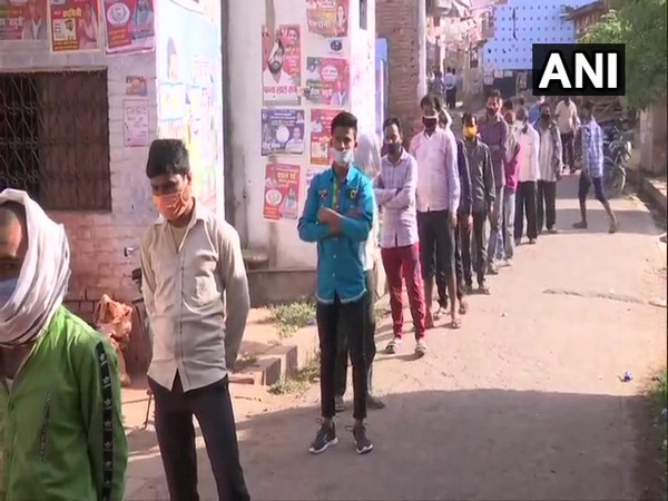 People standing in queue to cast vote for Panchayat polls in Lucknow. (Photo/ANI)