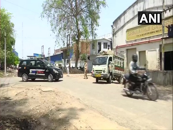 Police personnel accompany the oxygen transporting vehicle in Lucknow. (Photo/ANI)-