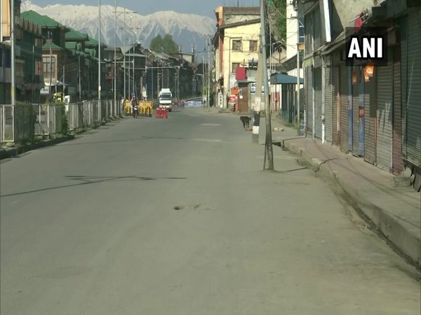 A deserted street in Srinagar during complete curfew on Sunday. [Photo/ANI]