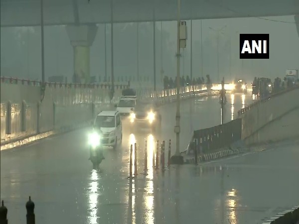 Rain lashes NH-24 in East Vinod Nagar area on Sunday morning (Photo/ANI)