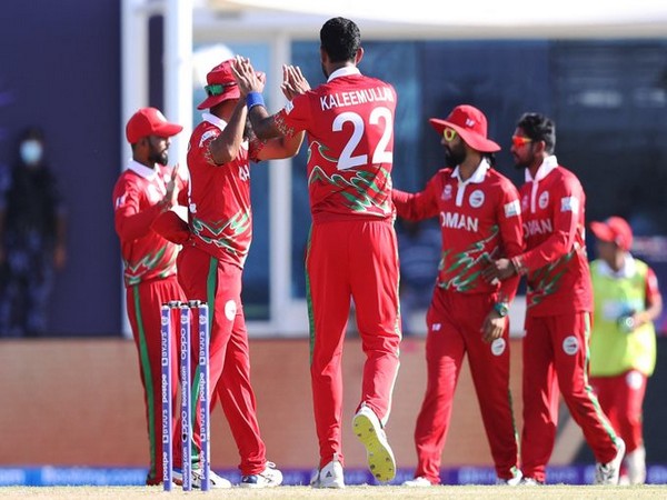 Oman cricket team in action against PNG (Photo/ T20 World Cup Twitter)