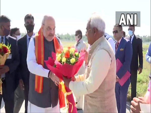 Union Home Minister Amit Shah was received by Chief Minister Pushkar Singh Dhami at the airport. (photo/ANI)