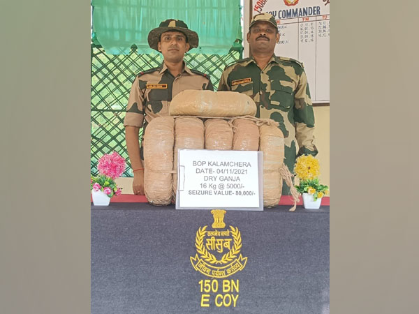 BSF personnel with Ganja seized during the operations. (Photo/@BSF_Tripura)