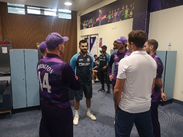 India skipper Virat Kohli with Scotland players (Image: Scotland Cricket's Twitter)