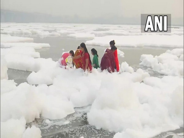 Devotees taking dip in toxic Yamuna water on first day of Chhath Puja. (Photos/ANI)