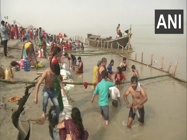 Devotees performing rituals and taking dip in river Ganga at Patna on occasion of Chhath Puja. (Photos/ANI)