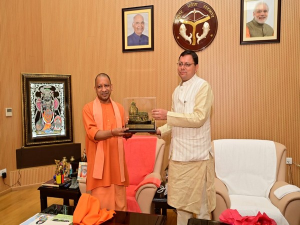 Uttar Pradesh Chief Minister Yogi Adityanath and Uttarakhand Chief Minister Pushkar Singh Dhami