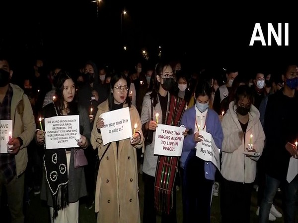 Human rights and students group hold candlelight vigil at Nagaland house in Delhi on Friday. (Photo.ANI)