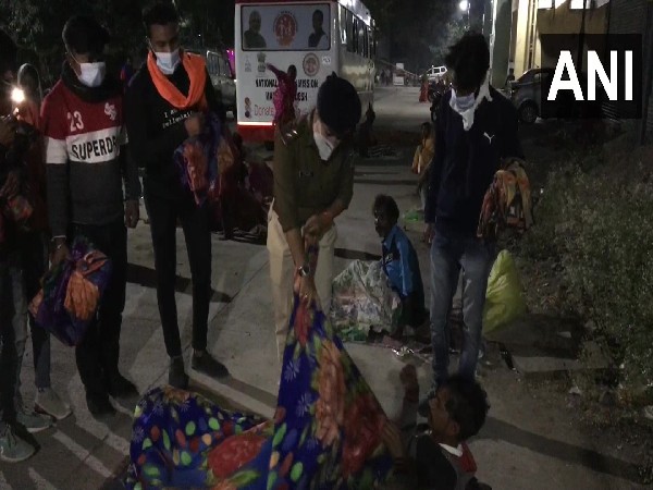 Anila distributing blanket to the needy. (Photos/ANI)
