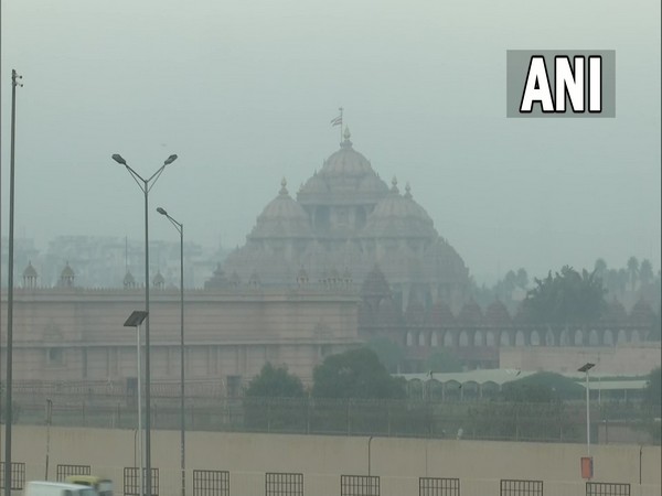A blanket of fog engulfs Akshardham Temple in Delhi on Friday.