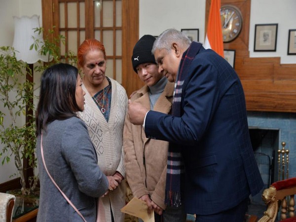 West Bengal Governor Jagdeep Dhankhar with family of late Havaldar Satpal Rai (Photo courtesy: Twitter)
