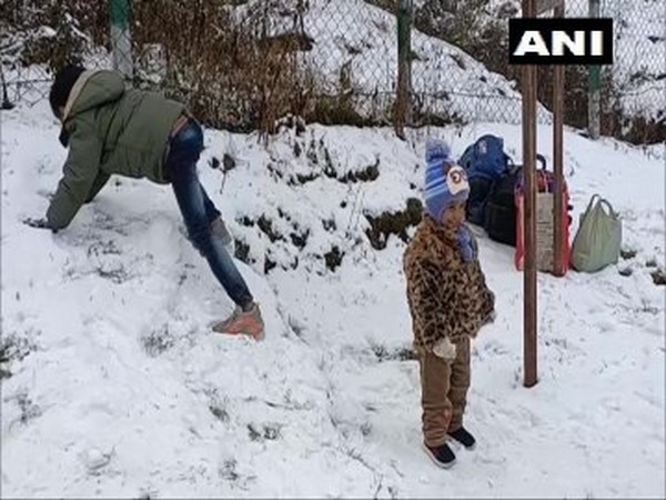Tourists enjoy first snowfall at Patnitop (Photo/ANI)