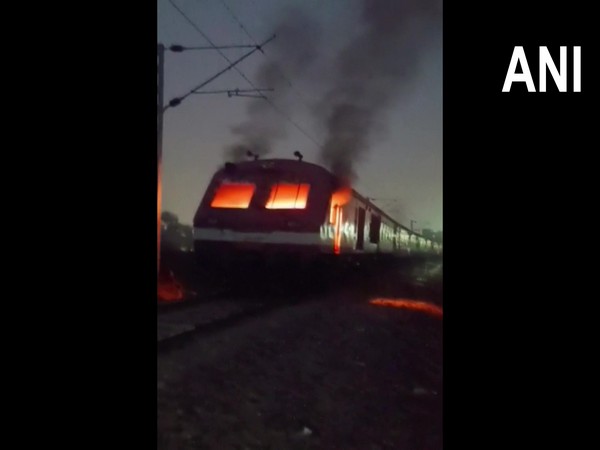 Protestors of RRB NTPC exam results allegedly set train on fire in Bihar's Arrah (Photo:ANI)