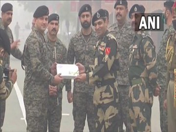 Border Security Force and Pakistan Army exchange sweets and greetings (Photo/ANI)